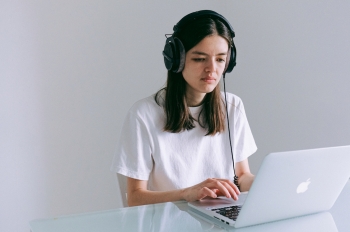 Canva - Woman In White T-shirt Using Macbook
